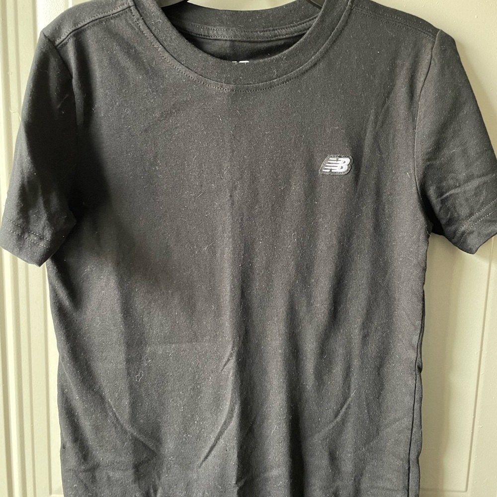 Boys New Balance and Santa Cruz Tees. Both size medium.